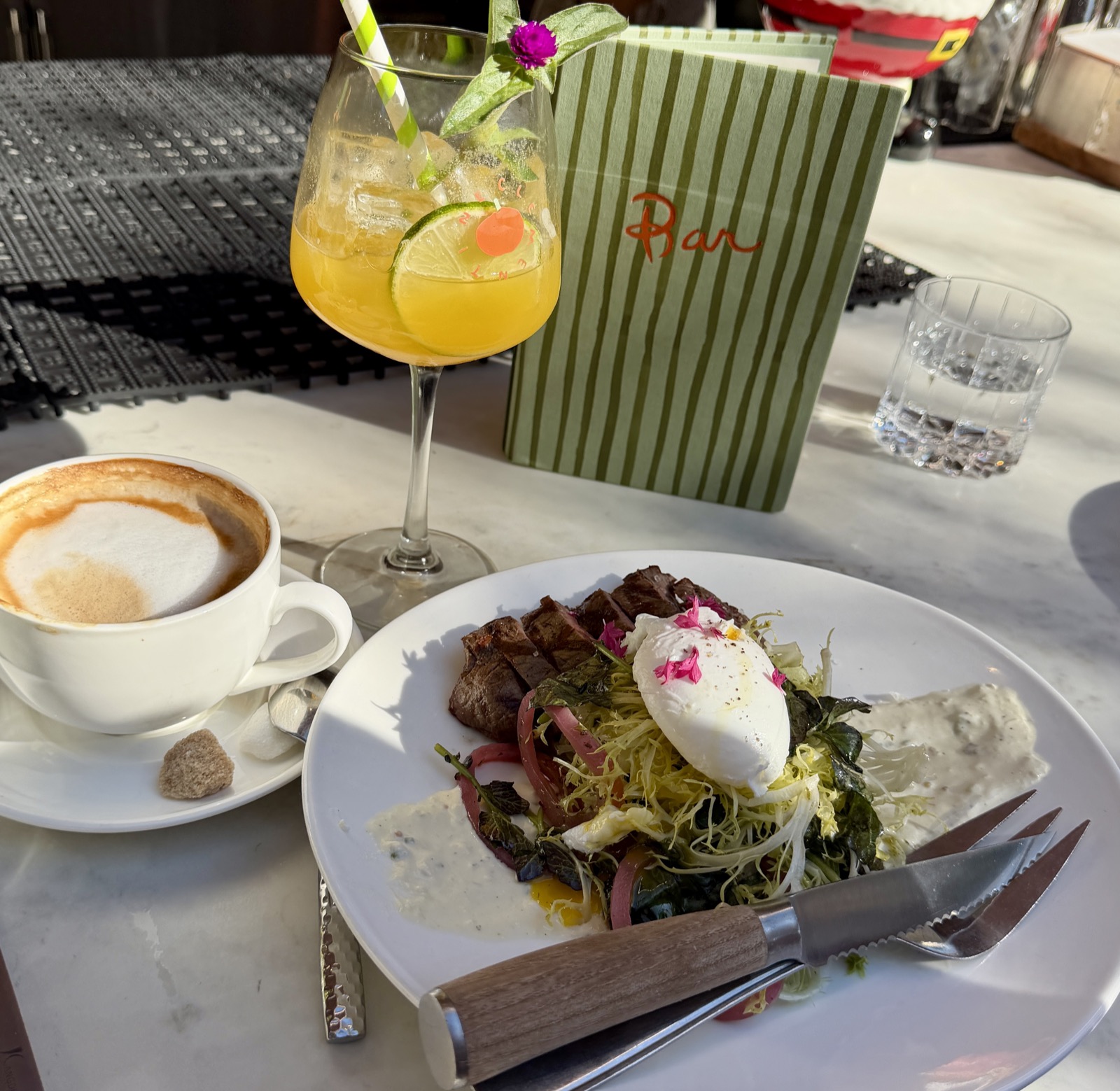 Clementine, Yountville restaurant, steak and eggs, latte and white cup with saucer, Clementine, Paloma with the bar menu in the background