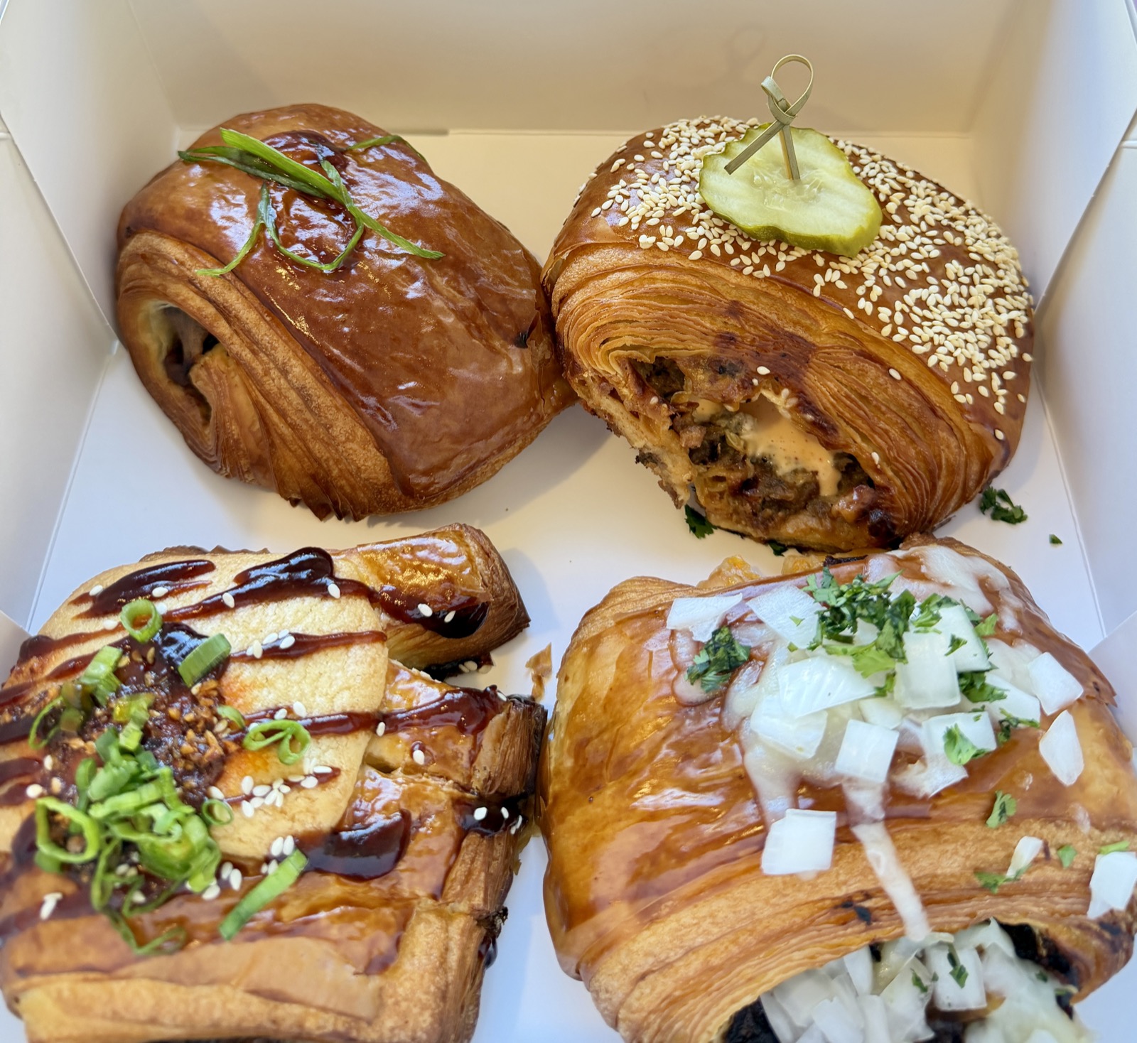A picture of four savory pastries from Butter and Crumble