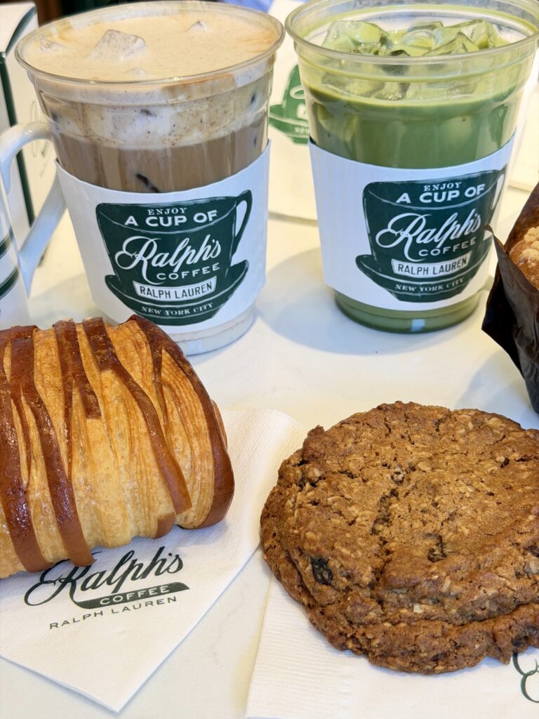 A picture of an iced latte and an iced Matcha with a chocolate croissant and oatmeal from Ralph's coffee in Newport Beach