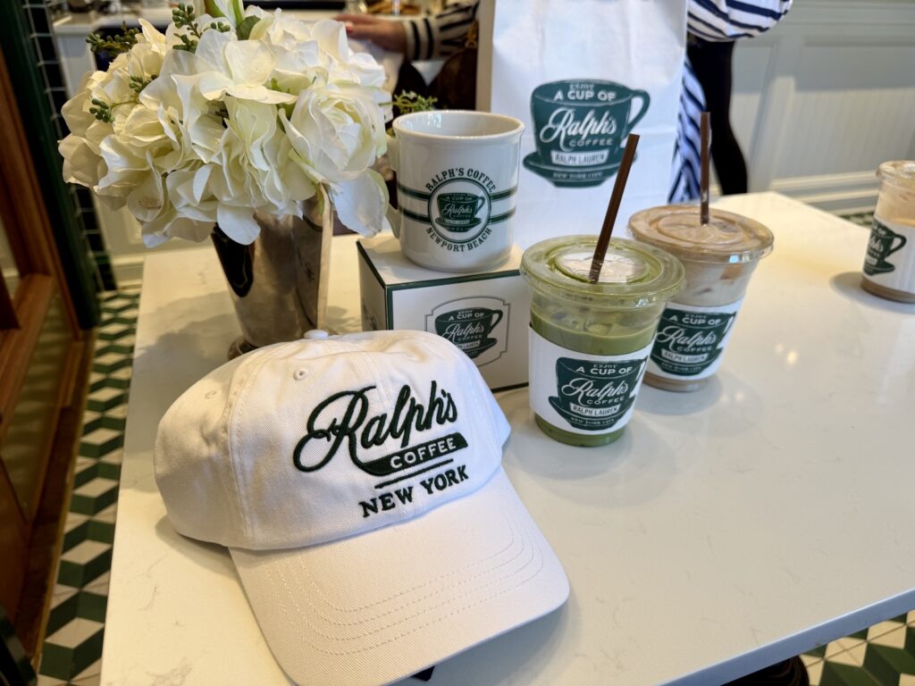 A picture of Ralph Lauren merch, and two iced lattes on a white marble table