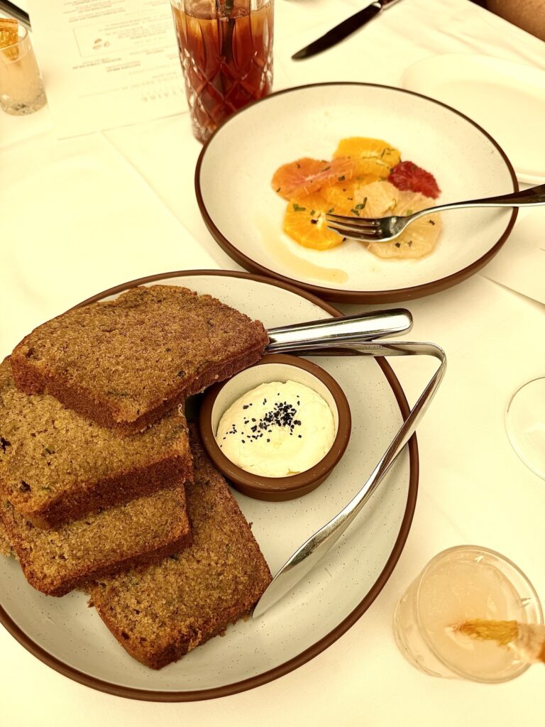 Brunch at Baltaire for the table to share zucchini bread with whipped honey butter, and a seasonal citrus salad with wildflower honey