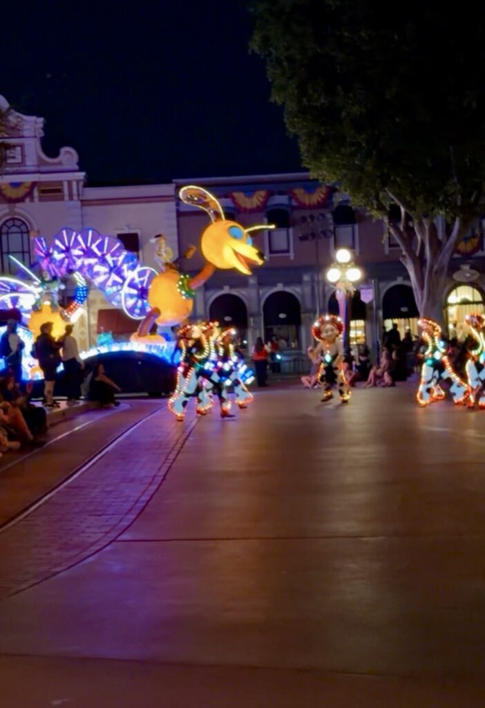 A picture of Toy story and Jesse from the Disneyland 70th anniversary celebration paint the night parade.