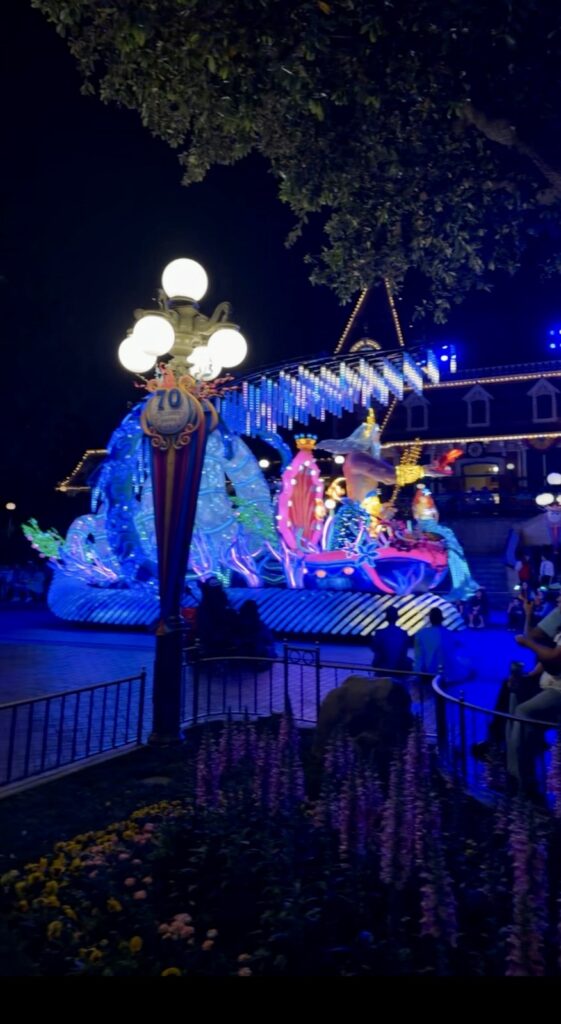 A picture of Disneyland 70th anniversary celebration paint the night parade King Triton.