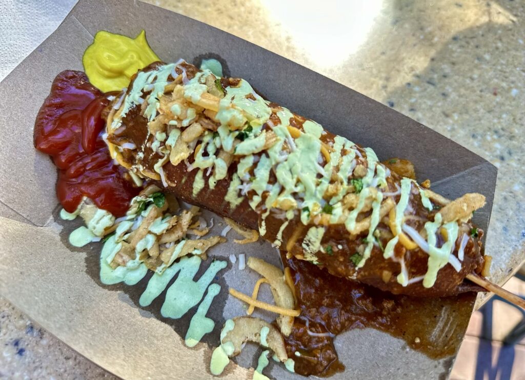 A picture of a corn dog with chili from the red truck at Disneyland this is a specialty item for the 70th anniversary