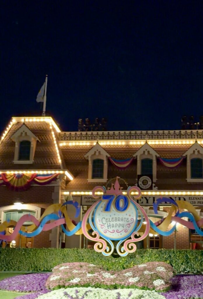 This is a picture of the train station at Disneyland a close-up picture with the 70th celebrate decoration