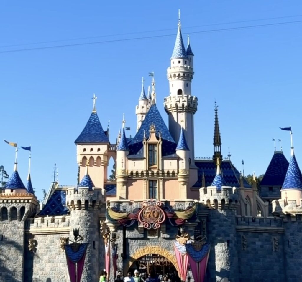 A picture of the castle decorated for Disneyland's 70th anniversary