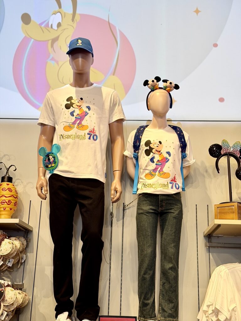 A picture of Disneyland's 70th Anniversary Celebration Collection displayed on mannequins.