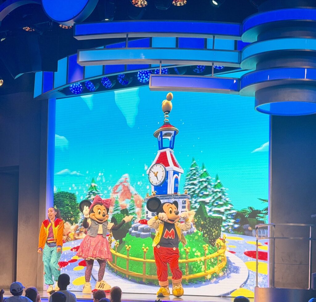A picture of Disneyland's 70th Anniversary Disney Jr. Mickey Mouse Clubhouse live on stage with Mickey and Minnie.