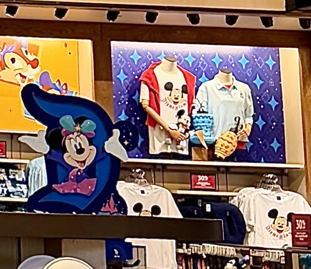 A picture of Disneyland's 70th Anniversary Nostalgia collection Googlie Eye t shirt and D pillow.