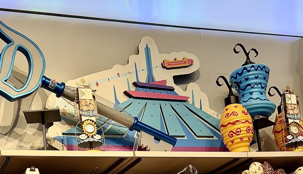 A picture of Disneyland's 70th Anniversary Nostalgia collection showcasing the lanterns and It's a Small World merch.