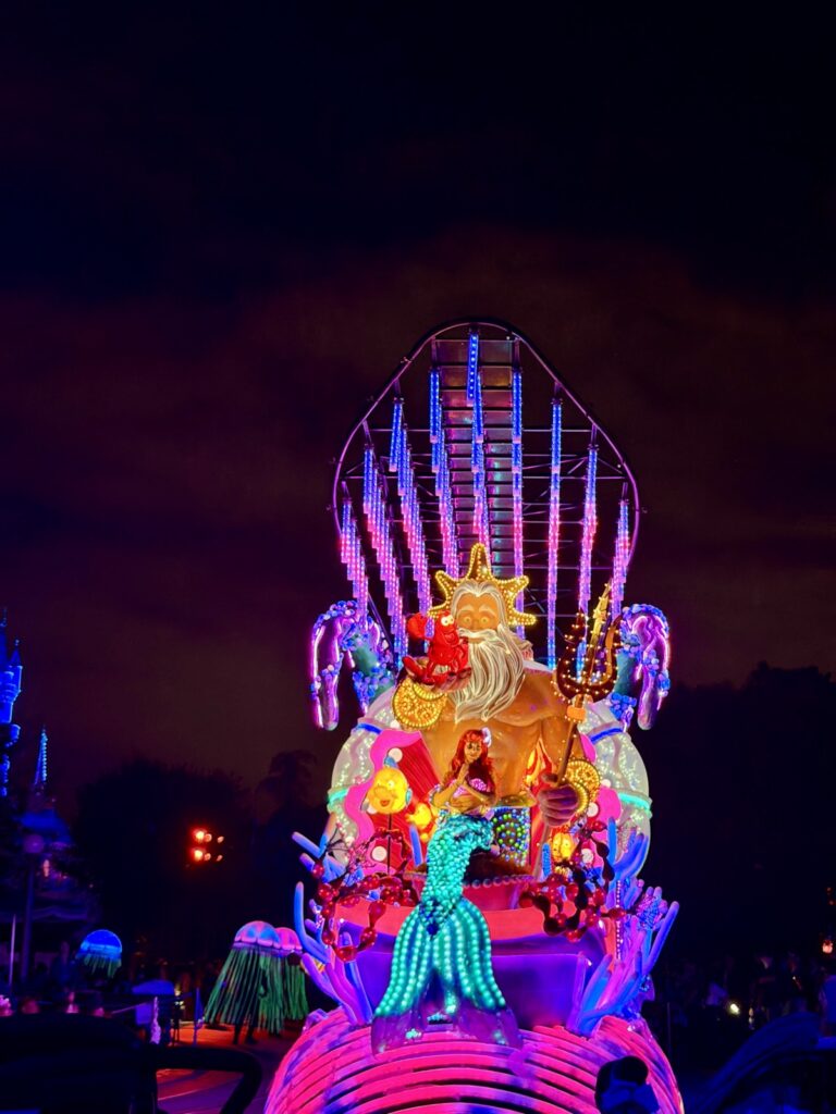 A picture of Disneyland's 70th Anniversary Paint the Night Parade of Ariel and King Triton.