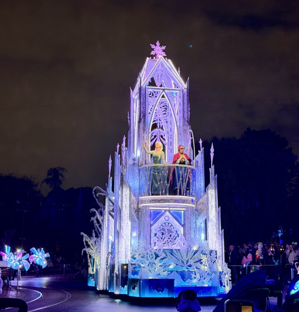 A picture of Disneyland's 70th Anniversary Paint the Night Parade with Elsa and Anna.
