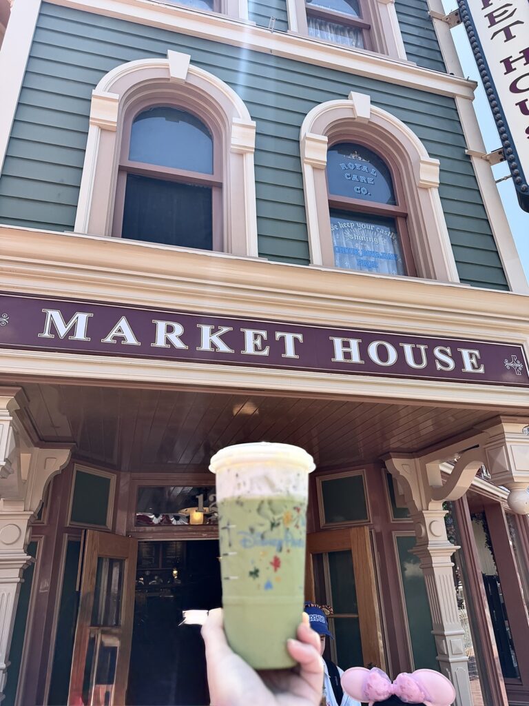 A picture of an iced Matcha in a Disney Starbucks cup from Starbucks in Disneyland on Main Street at the Market House location.